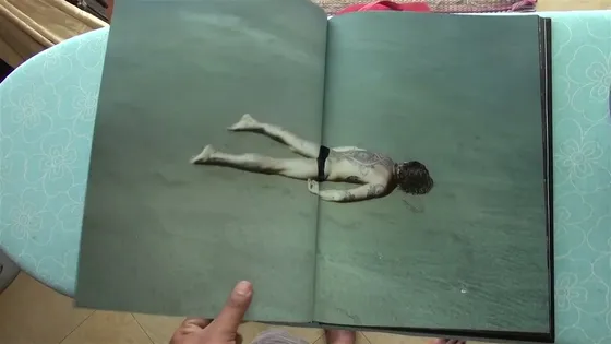Joker — spread, a figure in shallow water